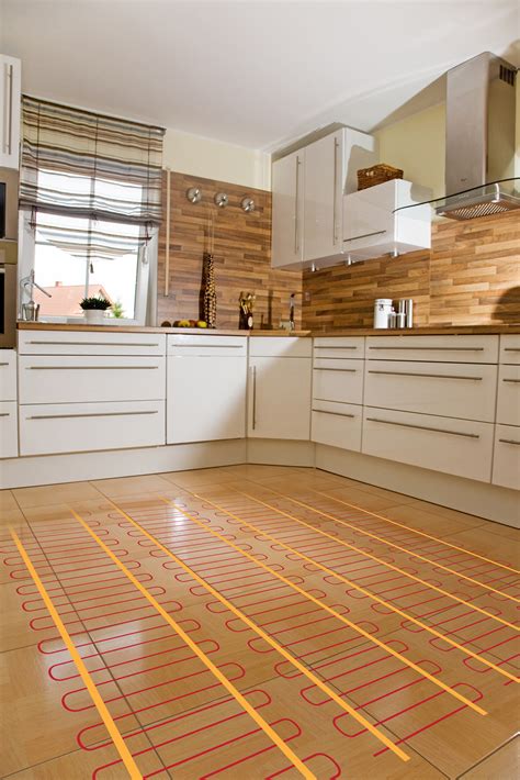 Electric floor heating. SunTouch® TapeMat® electric floor heating mat is a series resistance heating cable assembly designed for installation over plywood, backer board, or concrete slab (according to ANSI or TCNA guidelines), and then embedded in 3/8 in. (9.5 mm) or greater self-leveling or polymer-modified thin-set mortar. 