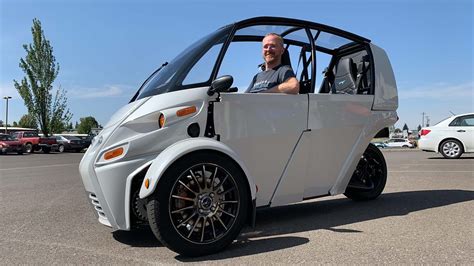 Electric three wheel car. 38 Photos. The i-Road is 92.3 inches long, 57.3 inches tall, and 34.3 inches wide, or slightly fatter than a scooter and a smidge slimmer than a large motorcycle. It weighs 660 pounds, and within ... 
