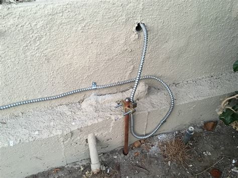 Electrical ground rod installation. Tighten the clamp with an adjustable wrench. Drill a small hole through the home's foundation, just large enough to fit the copper grounding wire through. Drill through a rim joist with an all-purpose wood bit; drill with a masonry bit through brick, cinder block or poured concrete. The size of the hole depends on the size of … 
