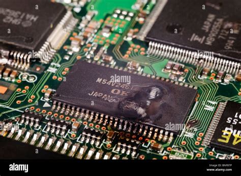 Electronic integrated circuit (IC) on a computer PCB after suffering a