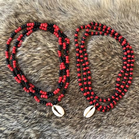 This red and black Elegua beaded bracelet is used to open all doors of opportunity and remove all obstacles in our path. A gift box is included. 100% SAFE FOR SENSITIVE SKIN: Take care of your loved ones with this red and black beaded Elegua protection bracelet. Beautifully crafted in the finest quality and precious stainless steel that is .... 