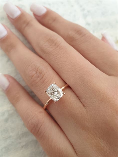 Elongated cushion cut engagement ring. Price: $42,000. Learn more about the Columbus Ring. The Columbus Ring dazzles from every angle and features a rare GIA-certified 3.21-carat elongated rose cushion-cut diamond with K color and VS1 clarity. Additionally, round brilliant-cut diamonds are micro-pavé-set along the four prongs, the gallery, and the shank. 3. 