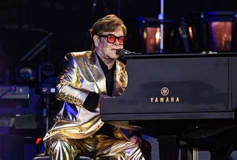Elton John briefly hospitalized after a fall, now back home and in ‘good health’