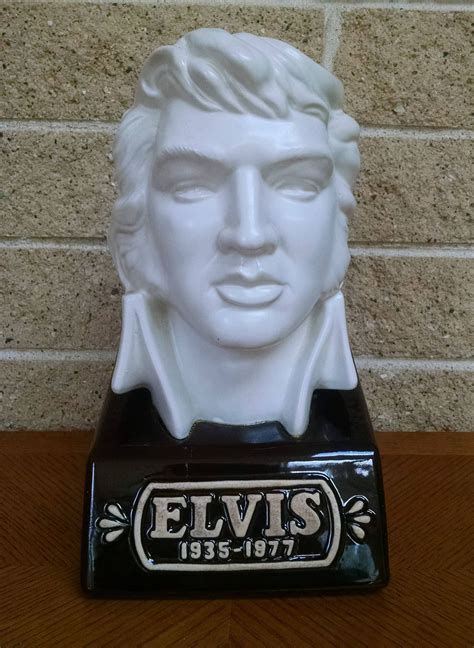The Elvis decanter comes in a beautiful purple / maroon Plush felt , opening and closing display Box with "Elvis Silver Anniversary " written in white at the base . Some liquid just leaked from the bottle and you can see it in the photo. it wiped off just fine. And the maroon felt display box sets within the original "Elvis Silver Anniversary .... 