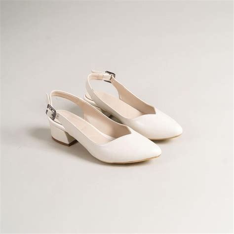 Embody Grace and Comfort with Our White Flats Shoes