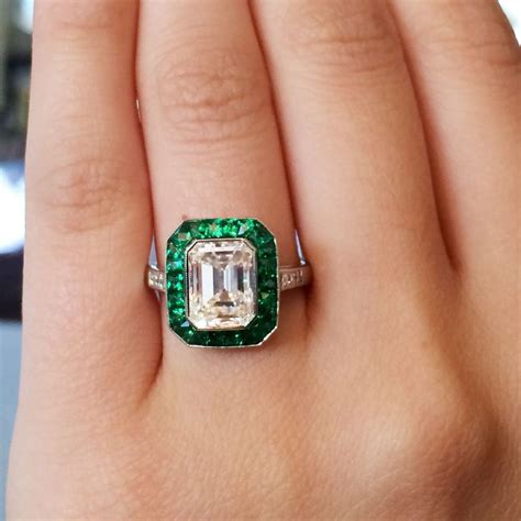 Emerald and diamond engagement ring. Shopping for an engagement ring? We'll show you how to maximize your purchase with our guide to the best credit cards for an engagement ring! We may be compensated when you click o... 