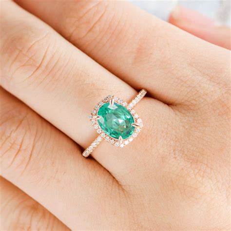  The cost of an emerald ring depends on the choice of metal and the gemstone itself. Emerald engagement rings can be more affordable than diamond rings or more expensive if they feature an eye clean stone. Emeralds free of inclusions are rare but part of the appeal of emerald jewelry is the included look called "jardin." . 