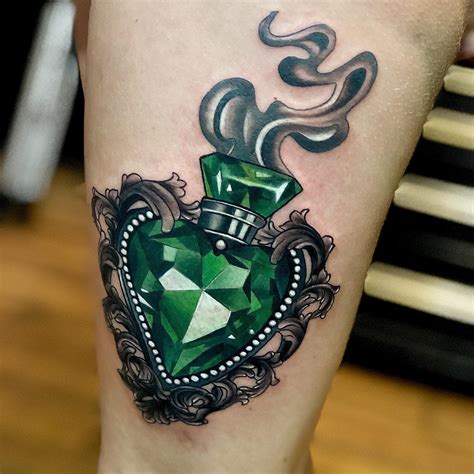 Emerald tattoo. Jun 22, 2020 ... 228 Likes, TikTok video from Jenna Kerr (@jennakerrtattoo): “#tattoo #lacetattoo #lace #jeweltattoo #emerald #heart #jewellerytattoo ... 