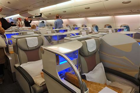 Emirate business class. Emirates’ A380 business class cabin is located on the upper deck, behind the first class cabin. The business class cabin features a total of 76 seats, spread across two cabins. There’s one massive business class cabin with 15 rows. 