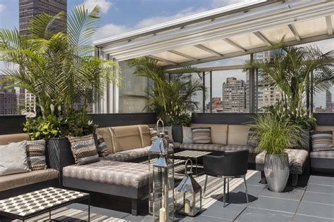 Empire rooftop. New World Design Builders Inc. 261 Madison Avenue, 25th Floor New York, NY 10016. Email Here. +1 212.216.9783. One of the main highlights of our portfolio, Empire Hotel Rooftop boasts a penthouse lounge with comfy seating and floor to ceiling windows. 