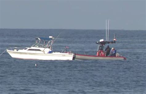 Empty fishing boat pulled from rocks in Carlsbad