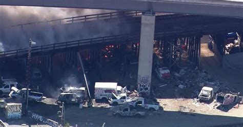 Encampment fire breaks out below 880 in Oakland, firefighters on scene