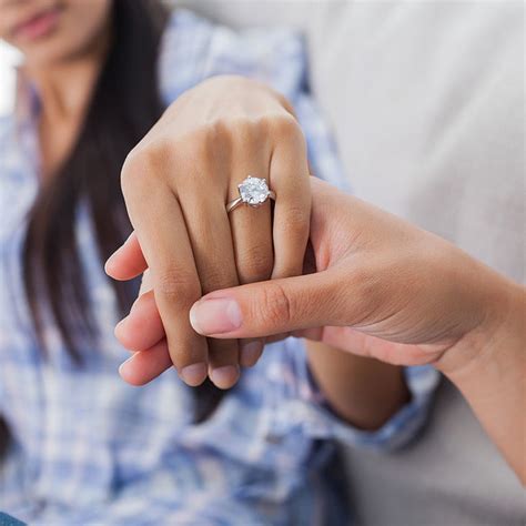 Engagement rings on hand. How does diamond carat weight impact oval engagement ring price? Because larger diamonds are more rare, the heavier the diamond, the higher the price. For example, a 1 carat oval diamond would be valued higher than two 0.50 carat oval diamonds of the same quality. In general, a doubling the size of your diamond can cost three to four times more. 