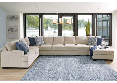 Enola sectional. A small chaise sofa, such as a two-piece sectional in a snowy chenille with exposed faux-wooden feet and low arms, looks crisp and modern. Extra-large sofas with chaise, such as a five-piece sectional with sculpted roll arms, linen-weave upholstery, and an abundance of plump throw pillows, feel right at home in a traditional or farmhouse space. 