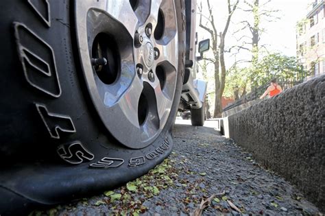 Environmental vandals deflate tires of 43 SUVs in Beacon Hill