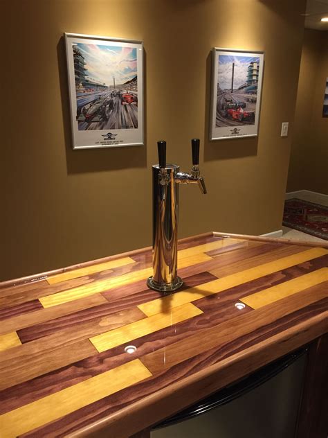 Epoxy bar top. JLB Renovations takes a unique approach to customize your commercial or residential space using high quality epoxy coatings. Our bar top and tabletop restoration services give new life to old, worn surfaces while increasing the durability and aesthetics. Epoxy can also be used to resurface your existing kitchen or bath countertops. New countertops or bar … 