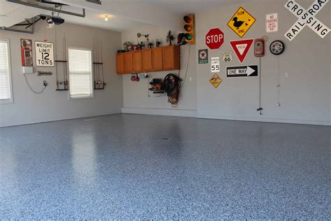 Epoxy floor in garage. About this item . Elevate your garage flooring with ArmorPoxy's 2-layer, 2-part epoxy kit, designed for both homeowners and businesses. This all-inclusive kit features industrial-grade epoxy, epoxy flakes tailored for garage floors, and a durable clear coat. 