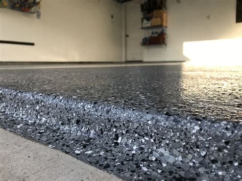 Epoxy for a garage floor. Key takeaways from this guide include: Cost: Professional installation of epoxy garage flooring typically ranges from $6 to $12 per square foot, while DIY epoxy floor kits can reduce costs to $2 to $6 per square foot. Durability: Epoxy floors are highly durable and can withstand heavy use, chemicals, salt, and impact. 