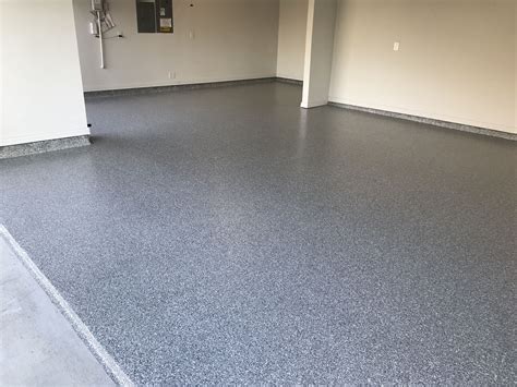 Epoxy garage floor coating. Fill any cracks or holes with concrete filler and allow it to dry. Then, mix and apply an epoxy primer to your floor using a nap roller and let it dry for 12-24 hours. Use a nap roller to apply 2 coats of epoxy, letting it dry for 12-24 hours between each coat. Finish with a top coat if necessary. Part 1. 