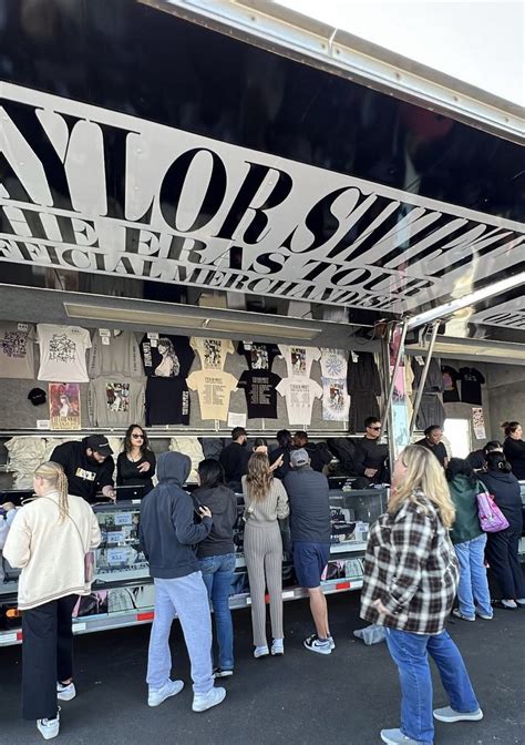 The merchandise trailer, filled with “Eras Tour” swag, has set up