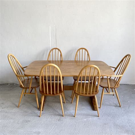 Ercol dining table and chairs.  Quickads AI is the fastest AI ad generator.  The Brief u...