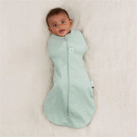 Ergo pouch. Jun 13, 2020 · As such we recommend a two-step approach to transitioning: Step One: Releasing one arm out of your baby's swaddle for all sleeps to allow your baby time to become used to this new way of sleeping. Step Two: After a week or so of one-arm-out sleeping, remove both arms from the swaddle. Expect some difficult sleeps during this phase, but stick ... 