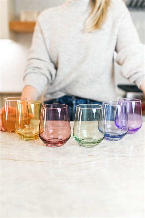 Estelle glass. Estelle Stemware Wine Glass, Set of 6. The founder of Estelle Colored Glass has named the collection in honor of her grandmother, Estelle, who she describes as "a jewel of a person that instilled in me an appreciation of the pastime of treasure hunting for beautiful finds -- especially for the kitchen which was the heart of her home." 