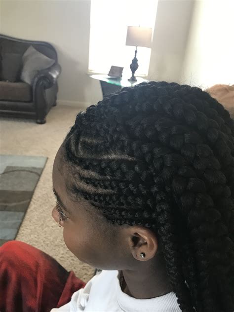 2. Medium Box Braids. Braided hairstyles for black women are a great chance to show your creativity! Alternate box braids with delicate curls. You can also play with your parting and try different patterns to diversify your braids hairstyles 2024. By Tasha Miles. 3. Upside Down Chunky Braids with Buns.. 