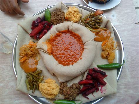 Ethiopian foods. Some Ethiopians identify with the black race, while others prefer to only identify with their Ethiopian heritage. Typically, Ethiopians have dark skin, but race is a socially const... 