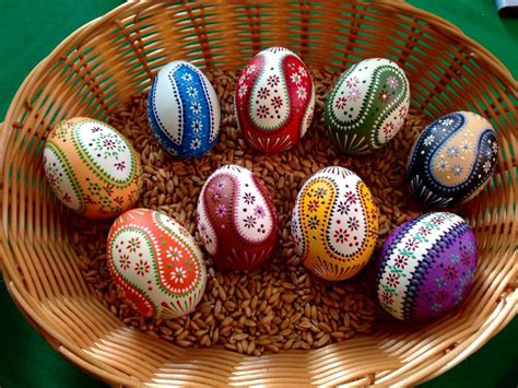 Meditative egg painting, Ukraine. Eggs represent renewal and life after death, and colourful Easter eggs (whether hard-boiled or chocolatey) can be enjoyed across Europe. The art of dyeing eggs dates back millennia ,and in Eastern Europe beetroots and onion skins are traditionally used to dye eggs dark red to symbolise the blood of Jesus Christ.. 