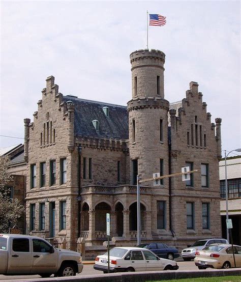 Vanderburgh County formed, Evansville named county seat 1818. (1) This castle-like structure was completed 1890 for county's fourth jail and second sheriff's residence. (2) Stone exterior has step-gables, projecting turrets, crenellated roof lines, simulated portcullis, and central, rounded tower. (3) Tunnel connects the jail to the 1890 .... 