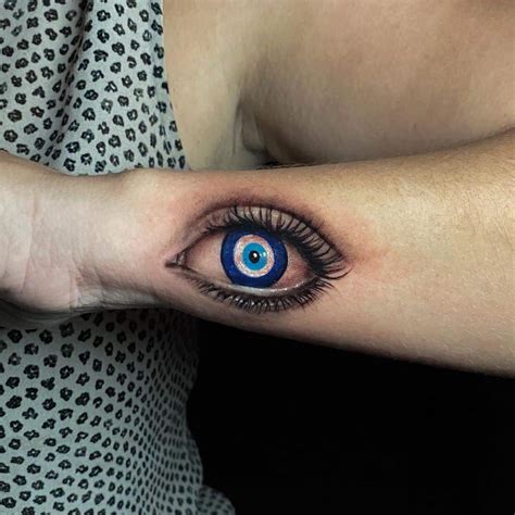 Evil eye tatoo. Tattoos found between the eyes are aimed at warding away the "evil eye" and harm that can come about as a result of it. Some women, upon converting from Yazidism to Islam, tattooed a moon symbol ... 