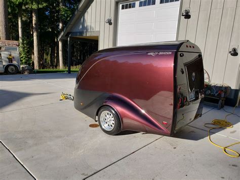 They're asking $1,500. Here is a link to Excalibur's webpage: Excalibur Trailers. Another company that makes an Excalibur-style trailer: excalibur type enclosed motorcycle trailer by magneta. The picture attached isn't the actual trailer (I can get some if you wish), but gives you an idea of the space and layout inside..