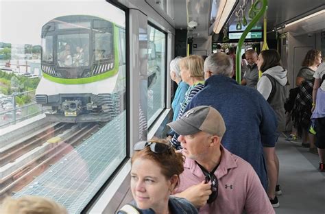Excitement, optimism as hundreds line up to ride Montreal’s new light-rail train line