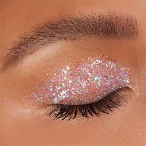 Eye glitter. Available in three shades featuring a white, pink or gold base with pearlescent, opal or coral glitter that shines at different angles. Apply a small amount on the middle of eyelid with the wand tip. Spread evenly on the eyelids and blend well with fingertips. Apply a small amount evenly on under-eye area using the wand's soft round tip. 