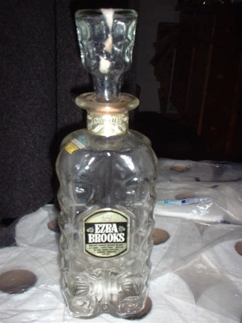 Add a touch of history to your collection with this Ezra Brooks Collectible Decanter from 1970. Featuring the iconic "Don't Tread on Me" theme, this decanter is a must-have for any distillery memorabilia enthusiast. Made by Ezra Brooks, a renowned brand in the industry, this vintage item is perfect for display or as a unique gift. The decanter is in great shape and ready to be showcased in .... 