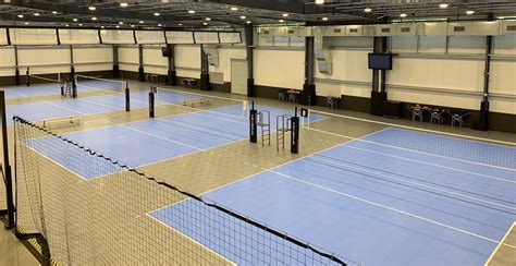 Facilities of volleyball. Volleyball is a game played between two teams of six players, separated by a net. Each team attempts to score points by pushing a ball over the net and landing it in the opposing team’s court. 