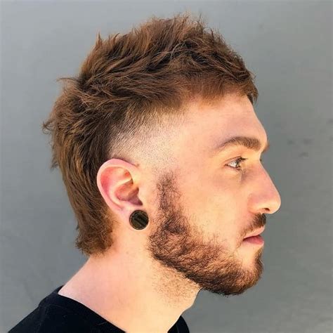 3. Short Burst Fade Mullet with Beards. @jmulica.hair. See: The short burst fade mullet is a fantastic, low-maintenance hairstyle. And: Pairing it with beards can create a …. 