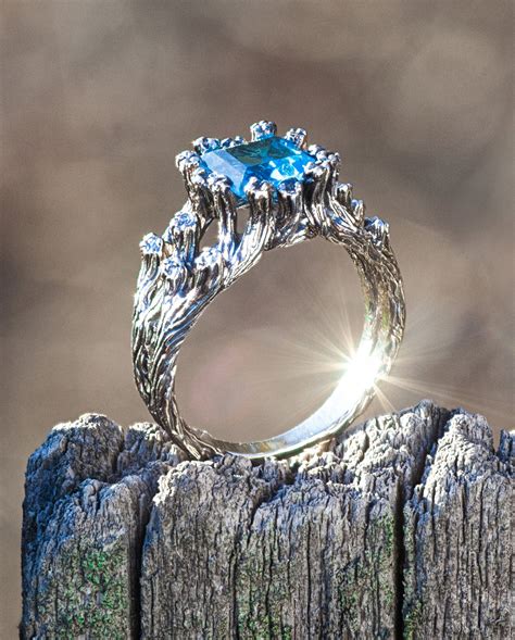 Fairy engagement rings. Olivia Ewing Jewelry creates interesting engagement rings and unique wedding bands inspired by the outdoors and made for active nature lovers. Each ring is hand crafted from recycled gold and made with rough uncut Montana sapphires, raw gemstones, rough diamonds, Moissanite, Oregon Sunstone, American sourced … 