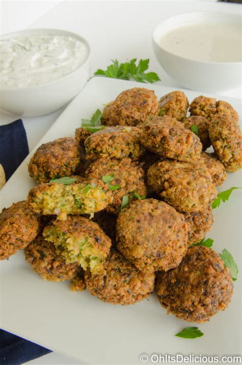 Falafel recipe with canned chickpeas. Blend 1/2 cup parsley and 1/4 cup cilantro finely. Add 1.4 oz onion, 1 tbsp garlic, seasonings (1/4 tsp salt, 1/2 tsp ground cumin, 1/4 tsp ground coriander), 1/2 tbsp all-purpose flour, 1/8 tsp baking soda, 1 tsp lemon juice, 1/16 tsp cayenne and blend.Add soaked chickpeas and blend. Scrape down the sides to get any big chunks at the bottom, and blend until there are no more big chunks. 