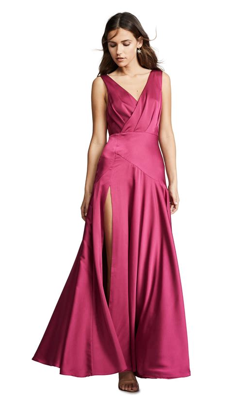 Fame and partners. Shell: 100% polyester. Lined. Lining: 97% polyester/3% spandex. Dry clean. Imported, China. Open back. Style #FPART30042. Sultry, yet elegant, this pleated Fame and Partners dress is finished with a plunging neckline and open sides. A long, off-center slit opens the graceful skirt. 