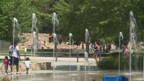 Families cool off from the dangerous heat at Citygarden splash pad