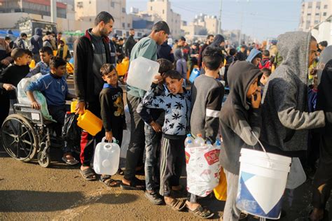 Families in Gaza search desperately for food and water, wait in long lines for aid