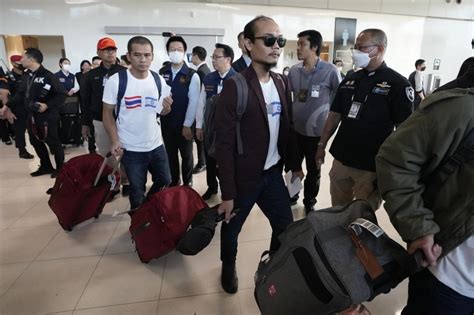 Families reunite with 17 Thai hostages freed by Hamas at homecoming at Bangkok airport