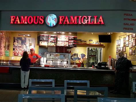 Famous famiglia. Famous Famiglia Pizzeria has kept reasonable Gotham hours, is reasonably priced, and is easy to find parking for given this part of the city has larger streets and more space to park. The standard pepperoni pizza was great, salads are great, and the service was good. 