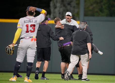 Fans who invaded Coors Field seeking selfies with Braves star Ronald Acuna Jr. charged with trespassing, disturbing peace