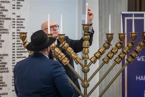 Far-right Polish lawmaker blows out Hanukkah candles in parliament