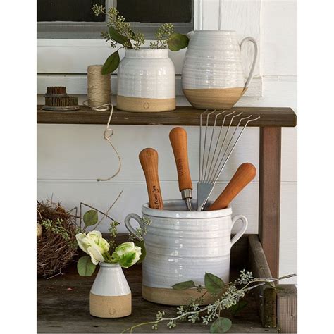 Farmhouse pottery. We thoroughly believe there's no such thing as too much olive oil. Classic in form and created with a stainless steel dispenser, this piece is both useful by the cooking range and beautiful on the table. Wheel thrown in Vermont. Durable American stoneware pottery. Oven, microwave, dishwasher safe. 