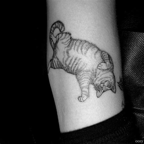 Fat cat tattoo. August 24, 2023. Uncover the meanings behind cat tattoos across cultures and beliefs. Learn about fascinating symbolism as well as the best ideas for … 