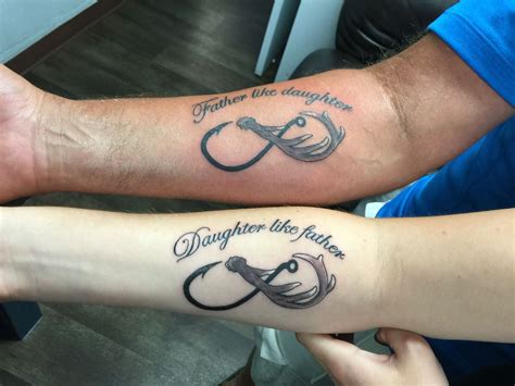 A name in a banner is a classic way to honor someone -- this one is in really great script and wraps around with the names of his children. This is a large tattoo, which makes it a bold and distinctive choice. 28/40. Christina Watson.. 